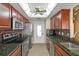 Modern kitchen, stainless steel appliances, granite counters at 4808 Vesper Ct, New Port Richey, FL 34655