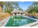 Backyard with in-ground pool and a fenced yard at 4939 18Th St, Zephyrhills, FL 33542