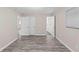 Bedroom with open doors leading to another room and bathroom at 4939 18Th St, Zephyrhills, FL 33542