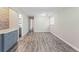 Open dining area with wood-look flooring and access to a hallway at 4939 18Th St, Zephyrhills, FL 33542