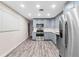 Bright, updated kitchen with stainless steel appliances and gray cabinetry at 4939 18Th St, Zephyrhills, FL 33542