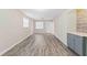 Living room with ample space, wood-look floors, and a serving bar area at 4939 18Th St, Zephyrhills, FL 33542