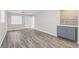 Living area with new wood-look flooring, neutral paint, and a built-in dry bar at 4939 18Th St, Zephyrhills, FL 33542
