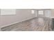 Spacious living room with wood-style flooring and abundant natural light at 4939 18Th St, Zephyrhills, FL 33542