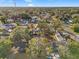 Aerial view of a residential neighborhood with houses, trees, and streets at 4939 18Th St, Zephyrhills, FL 33542