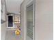 A view of the home's side entrance, showcasing the door and adjacent storage or utility area at 4939 18Th St, Zephyrhills, FL 33542