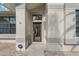 Elegant front entryway with a stained-glass door and an ADT security system at 591 Waterford W Cir, Tarpon Springs, FL 34688