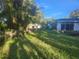Large backyard with two houses. Needs landscaping at 7222 N Ola Ave, Tampa, FL 33604