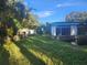 Spacious backyard with a detached building and water access at 7222 N Ola Ave, Tampa, FL 33604