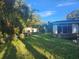 Spacious backyard with a detached building and water access at 7222 N Ola Ave, Tampa, FL 33604
