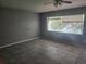 Bright bedroom with large window and tile floor at 7222 N Ola Ave, Tampa, FL 33604