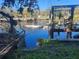 Rustic boat dock with damaged boat on the river at 7222 N Ola Ave, Tampa, FL 33604