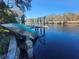 Damaged boat at rustic boat dock on calm river at 7222 N Ola Ave, Tampa, FL 33604