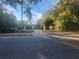 Long driveway leading to a house with a gated entrance at 7222 N Ola Ave, Tampa, FL 33604
