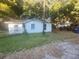 White house with small front yard, needs some TLC at 7222 N Ola Ave, Tampa, FL 33604