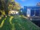 White house with a fenced yard and lush green grass at 7222 N Ola Ave, Tampa, FL 33604