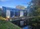 Mid-century home with large windows overlooking a canal at 7222 N Ola Ave, Tampa, FL 33604
