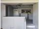 Open kitchen with a breakfast bar and stainless steel appliances at 7222 N Ola Ave, Tampa, FL 33604