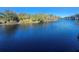 Picturesque waterfront view with calm waters and abundant trees at 7222 N Ola Ave, Tampa, FL 33604