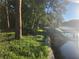 Waterfront property with a damaged boat and dock at 7222 N Ola Ave, Tampa, FL 33604