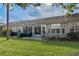 Spacious backyard with patio and lush lawn at 7423 Woodhollow Rd, Spring Hill, FL 34606