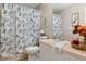 Clean bathroom with shower/tub combo, toilet and vanity at 7423 Woodhollow Rd, Spring Hill, FL 34606