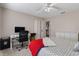 Bedroom with a bed, dresser, and home office setup at 7423 Woodhollow Rd, Spring Hill, FL 34606