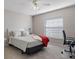 Bedroom with bed, ceiling fan and home office space at 7423 Woodhollow Rd, Spring Hill, FL 34606
