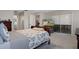 Main bedroom with a comfortable sleigh bed and views of backyard at 7423 Woodhollow Rd, Spring Hill, FL 34606