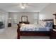 Main bedroom with a sleigh bed and access to the balcony at 7423 Woodhollow Rd, Spring Hill, FL 34606
