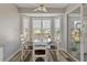 Cozy breakfast nook with table and chairs near a window at 7423 Woodhollow Rd, Spring Hill, FL 34606