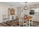 Quaint dining room featuring a wooden table and white hutch at 7423 Woodhollow Rd, Spring Hill, FL 34606