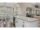 Kitchen boasts granite counters, white cabinets, and a breakfast nook at 7423 Woodhollow Rd, Spring Hill, FL 34606