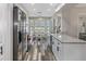 Modern kitchen with stainless steel appliances and white cabinetry at 7423 Woodhollow Rd, Spring Hill, FL 34606