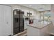 Modern kitchen with granite countertops and white cabinets at 7423 Woodhollow Rd, Spring Hill, FL 34606