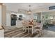 Bright kitchen with stainless steel appliances and an adjacent dining area at 7423 Woodhollow Rd, Spring Hill, FL 34606