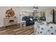 Open and bright living area with comfortable seating and view of the sliding glass doors at 7423 Woodhollow Rd, Spring Hill, FL 34606