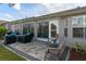 Outdoor patio with seating area and fire pit at 7423 Woodhollow Rd, Spring Hill, FL 34606