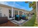 Relaxing patio with seating area and fire pit at 7423 Woodhollow Rd, Spring Hill, FL 34606