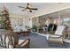 Sunroom with view into living room and access to backyard at 7423 Woodhollow Rd, Spring Hill, FL 34606