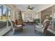 Relaxing sunroom with wicker furniture and a Christmas tree at 7423 Woodhollow Rd, Spring Hill, FL 34606