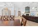 Open concept dining area with a wooden table and view of the living room at 7443 Oak Tree Ln, Spring Hill, FL 34607
