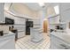 Bright kitchen features white cabinetry, black appliances, and ample counter space at 7443 Oak Tree Ln, Spring Hill, FL 34607
