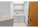 Laundry room with washer, dryer, and utility sink at 7443 Oak Tree Ln, Spring Hill, FL 34607