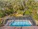Elevated perspective of the screened pool and backyard at 7443 Oak Tree Ln, Spring Hill, FL 34607