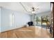 Bonus room featuring hardwood floors, a ceiling fan and a slider to the outdoor patio space at 7600 138Th St, Seminole, FL 33776