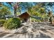 Charming single-story home featuring a stone facade, covered entry, and mature landscaping for enhanced curb appeal at 7600 138Th St, Seminole, FL 33776