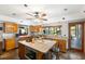 Open kitchen with an island, granite countertops, and stainless steel appliances at 7600 138Th St, Seminole, FL 33776