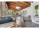 Inviting patio offers a great place to relax, boasting natural wood ceilings and bar with stools at 7600 138Th St, Seminole, FL 33776