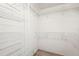 Spacious walk-in closet with wire shelving at 7717 Cosme Dr # 2, Hudson, FL 34667
